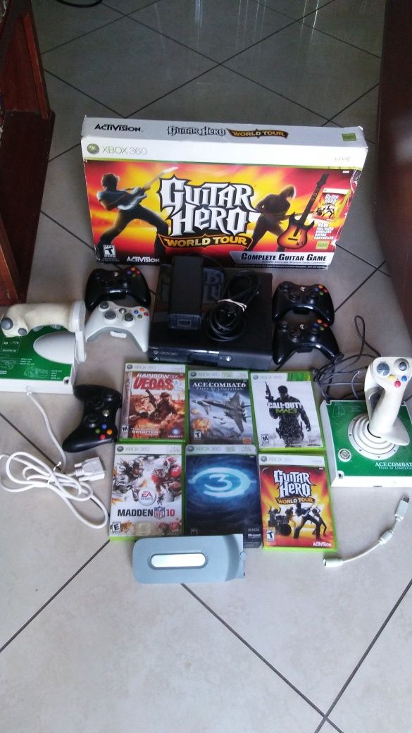 Used 360 Xbox with 6 games, 5 , guitar, and 2 extra. 2 contoler for flying the airplane game. A hardrive included.Everything works.