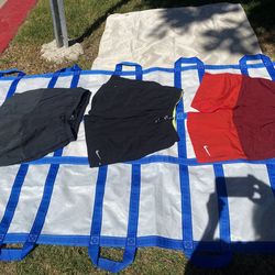 Nike brand men’s shorts size L.and one red size9M. All3 $30 or each $12