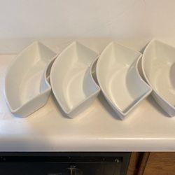 Four heavy porcelain side dishes, new.