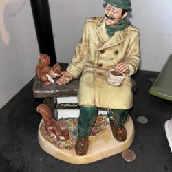 Porcelain Statue old man in the park