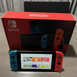Nintendo Switch System- Version 2 - Works Great - Includes Cables And Dock and sonic game . System has some scratches but works great - 