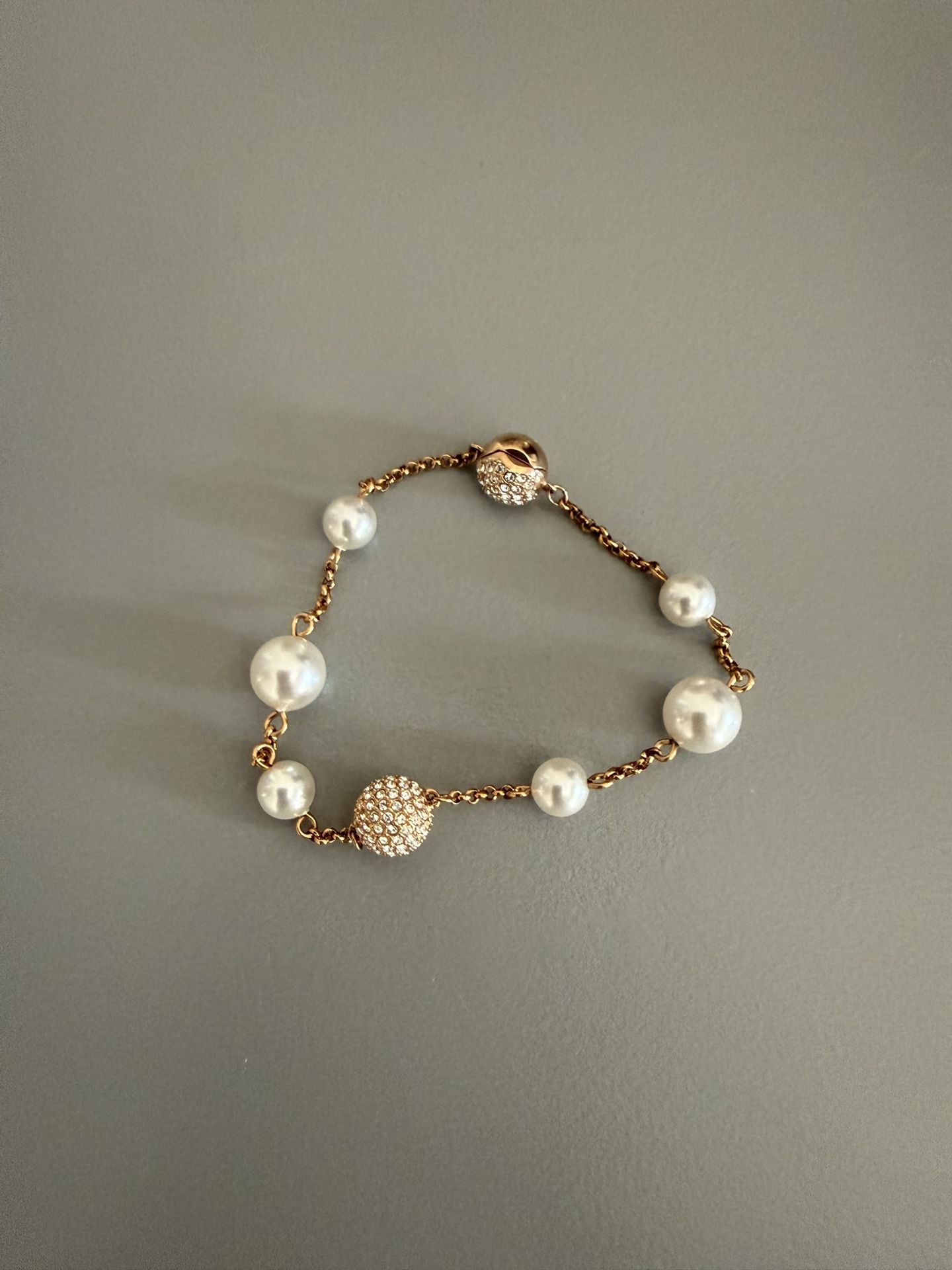 Swarovski women’s gold and pearl Bracelet