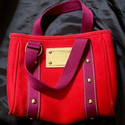 Authentic LOUIS VUITTON CABAS ANTIGUA PM TOTE. Color; Red. Excellent Condition
