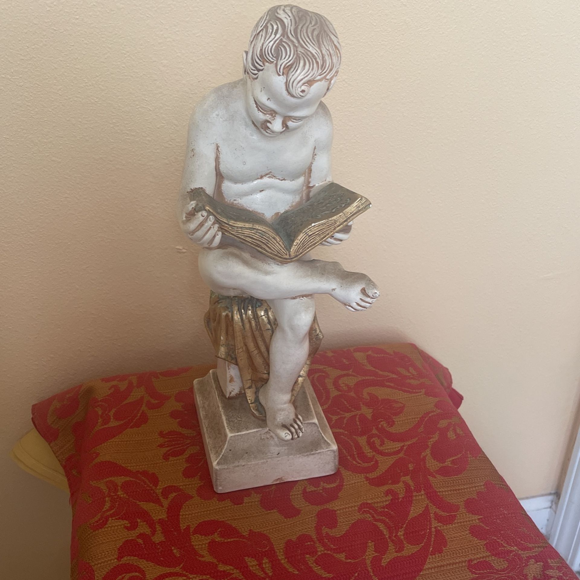 Jaru art pottery sitting child reading