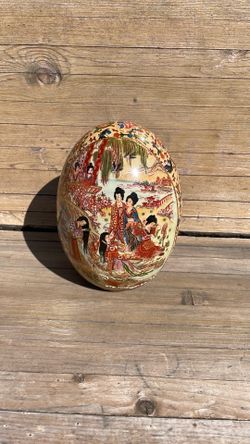 Beautiful, painted egg shape, ceramic decor piece.
