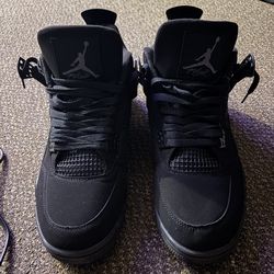 Black cat Jordan 4s