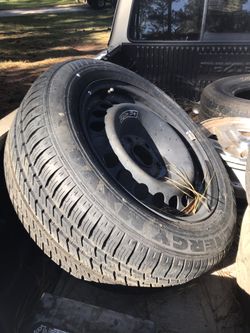 BRAND NEW SPARE TIRE AND RIM
