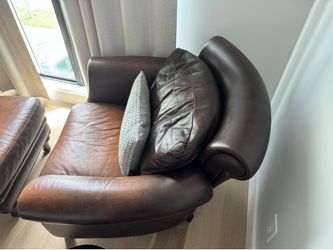 Brown leather chair with ottoman