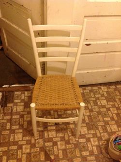 White wood chair with wicker seat