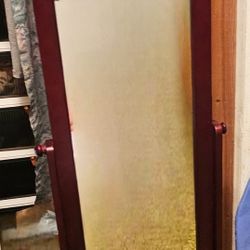 Barely used, mahogany wooden framed asjustable mirror with wheels