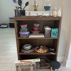 Bookcase,… dishes….soap pumps….kitchen tools….2 wases….car phone holder…..brand new barbecue tools…. 4 watches and more all together