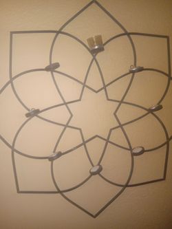 A tea cup candle holder for the wall