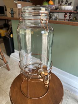 Glass drink dispenser with metal stand