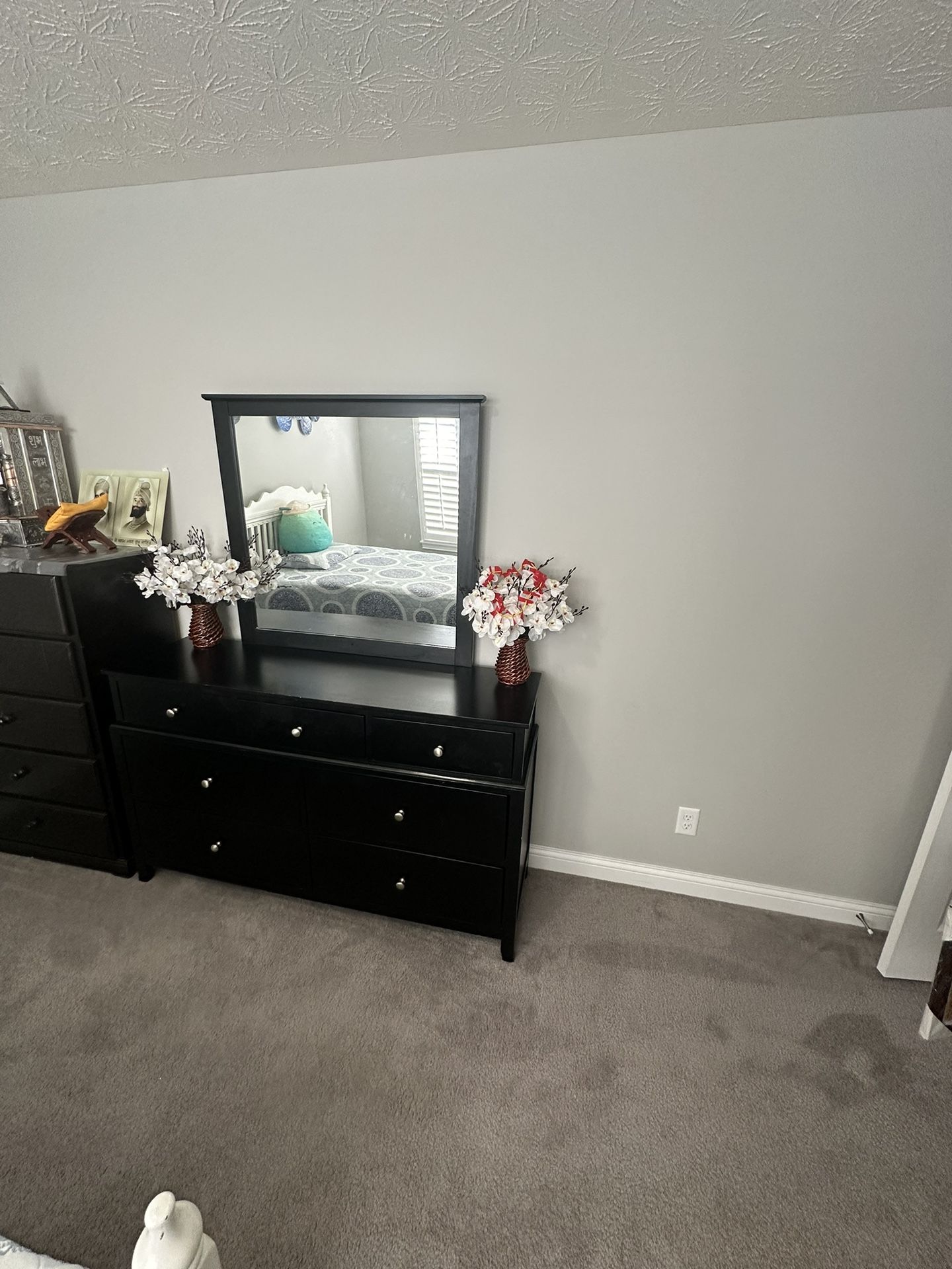 White Bed And Mattress And Black Dresser Table