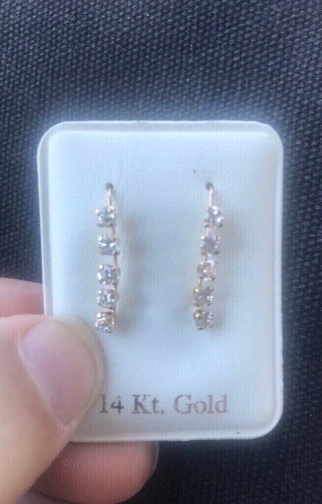 New. 14k yellow gold and diamond like moissenite earrings. Moissenite is a natural stone that looks very much like diamond. Solid gold. Great gif