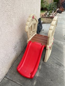 Toddlers play slide