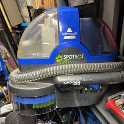 Bissell SpotBot Pet hands-free portable spot and stain deep cleaner.