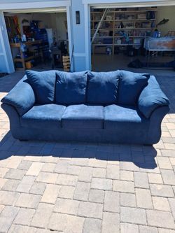 Blue Upholstered Couch and Armchair