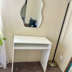 Vanity With Curvy Mirror And White Desk