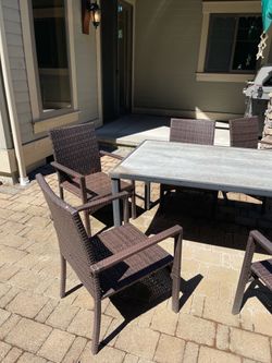 Seven Piece Patio Table and Chairs