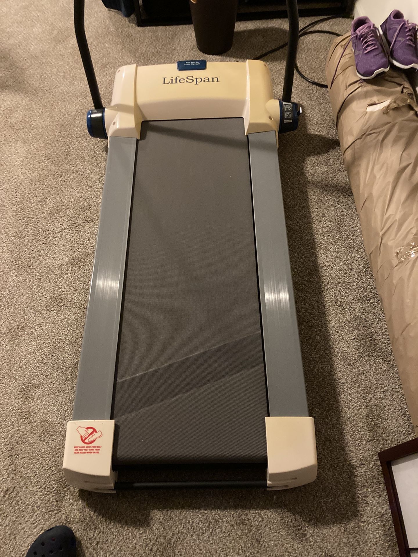 Folding treadmill by Lifespan