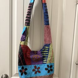 A women's satchel made of colorful artisanal fabric