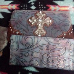 A Wallet With The Cross On It
