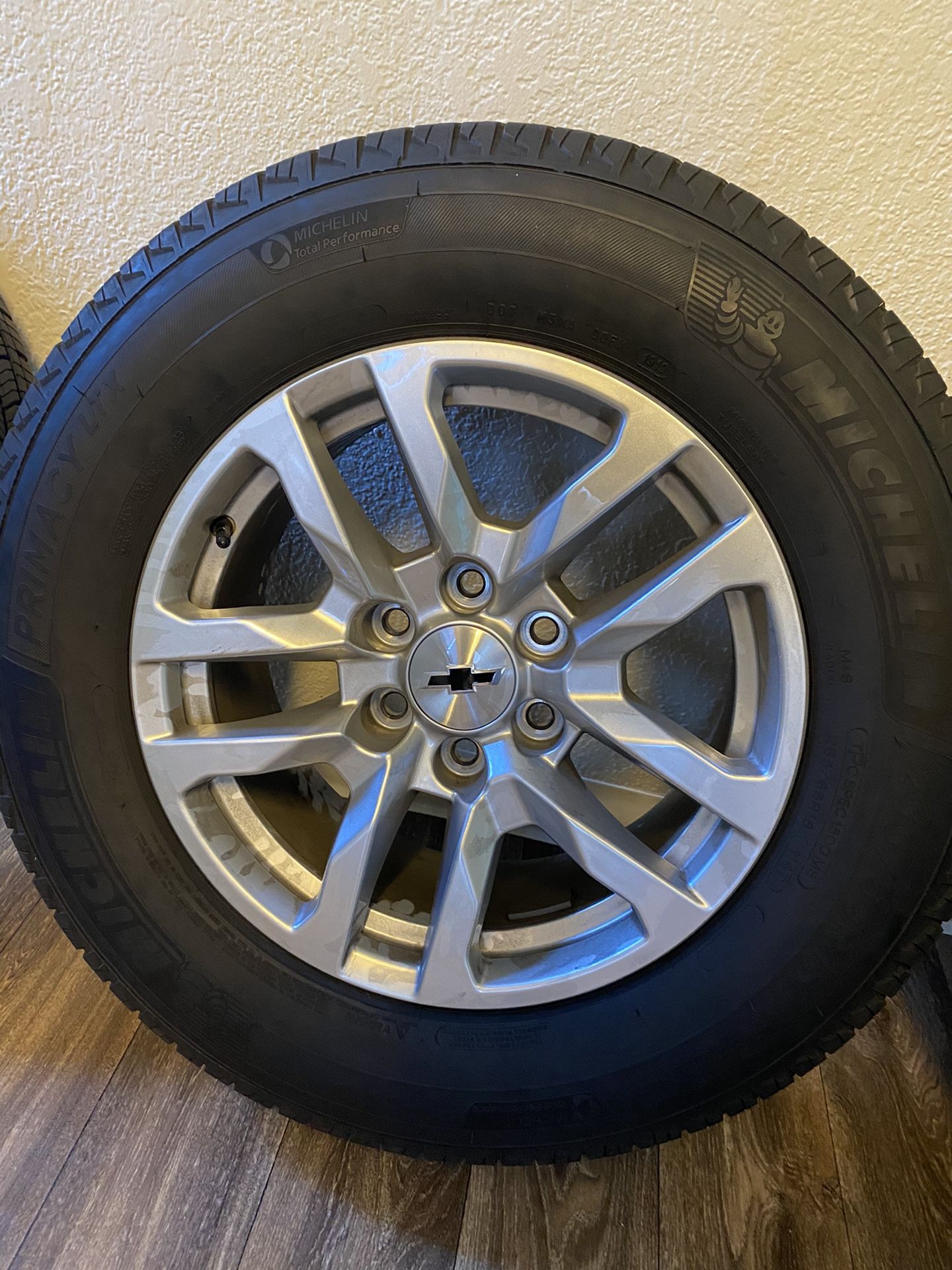 I have a set of 2019 265/65/18 inch Chevy Silverado 6 lug tires and wheels with new Michelin tires with no dents or scratches on the rims that will f