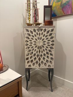 Carved Wood Jewelry Armoire with Sunburst Design