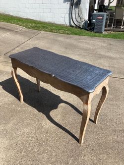 Table with silver foil top
