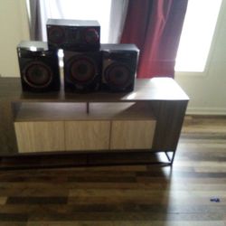 Need Gone Today. Make Offer.  TV Stand And  LG Mp3  Speaker System 