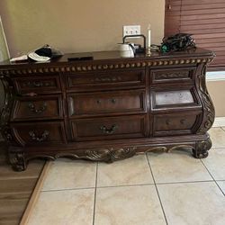 Dark Cabinet With Background Glass And A Storage Container Dark Wood 