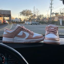 Classic Nike Dunk Low silhouette with a fresh pink and white colorway.
