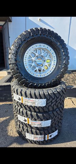 17" KMC rims w/ 35x12.50R17 Toyo MT Open Country