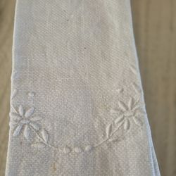 a vintage hand towel with Embroidered flower design on the end