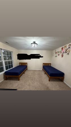 Two twin bed frames with mattress