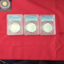 3 Slabbed Silver Dollars