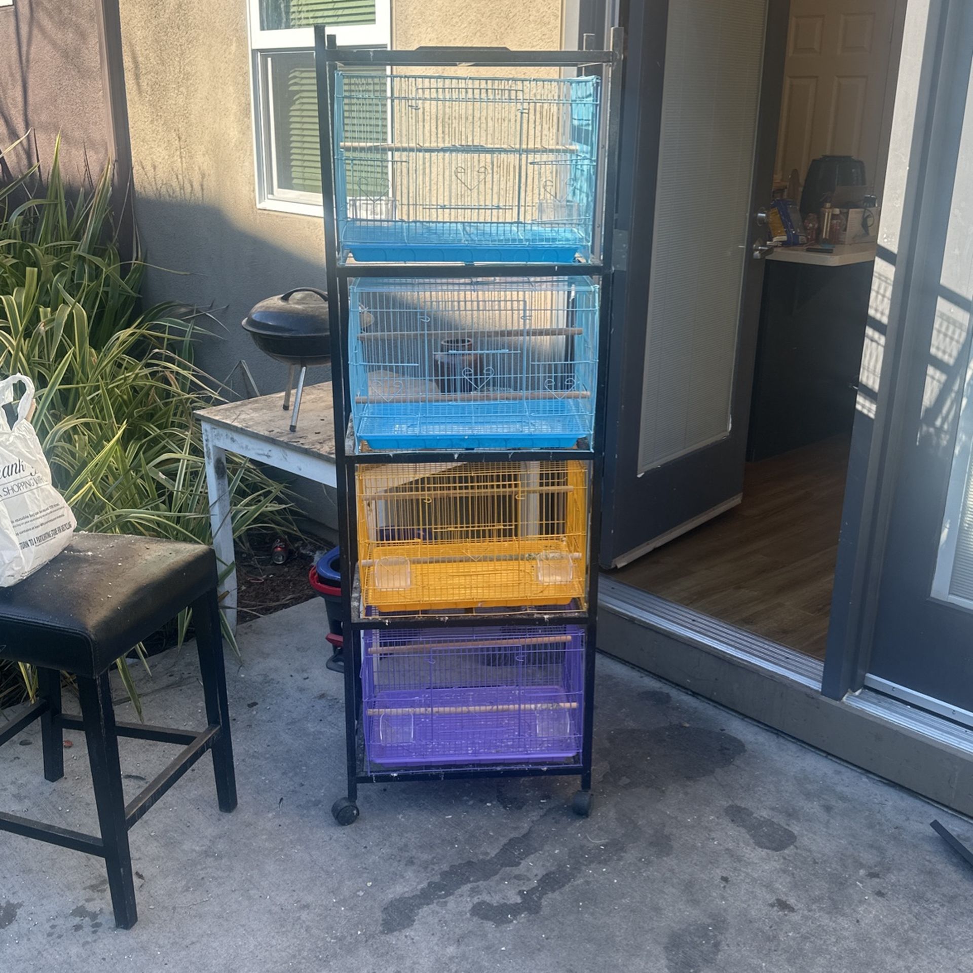 4 Used Bird Cages With Stand On Wheels
