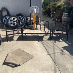 Metal bench with two chairs