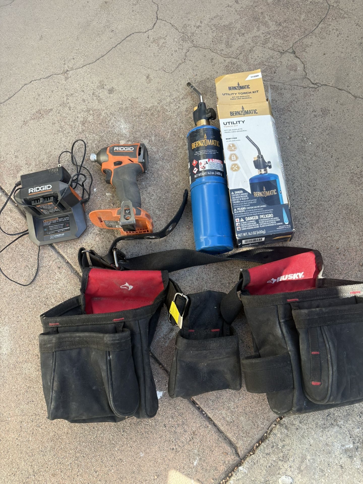 Husky Tool Belt , Ridgid Impact Drill And Charger, Torch