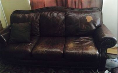 Sofa tan leather - left part is scratched that is the patch.