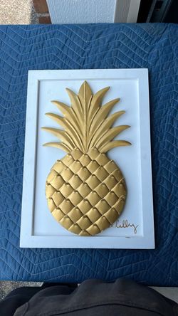 Features a textured, embossed gold pineapple centerpiece with detailed leaf and rind patterns.