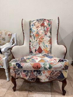 Old wooden wingback chair