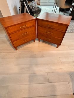 A pair of wood nightstands