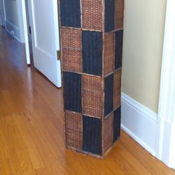 handsome woven black and brown decorative stand. Dimensions: 9.5 In X 9.5 In X 36 In Tall