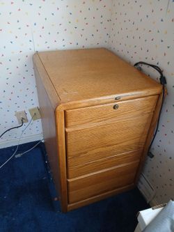 Filing cabinet. Solid wood, $8.00