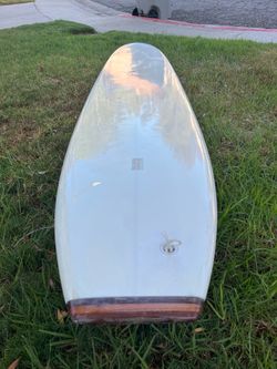 9’ 11” nose rider longboard ready for wax and the beach