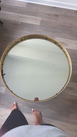 golden circular mirror