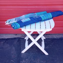 Two Umbrellas and A Table $25