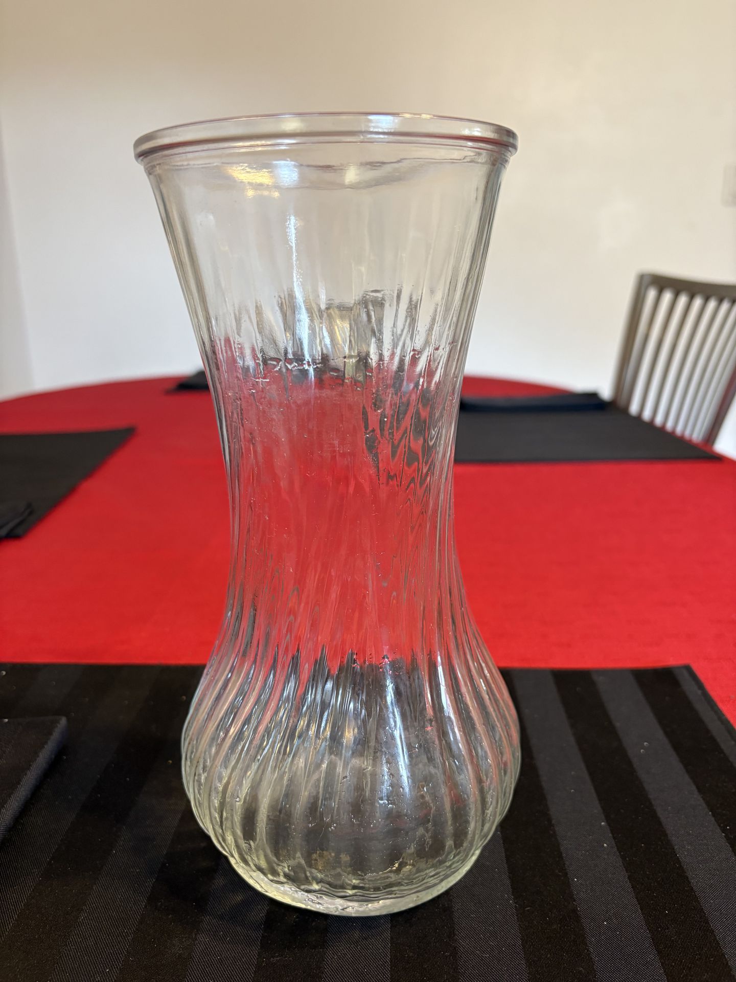 Vintage Hoosier glass vase featuring a distinctive swirl design 9.5” tall, 4.5” diameter